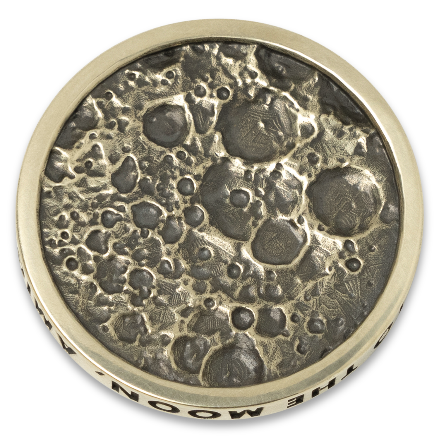 Brass coin with moon surface design on a white background. made for Moon Crew Members