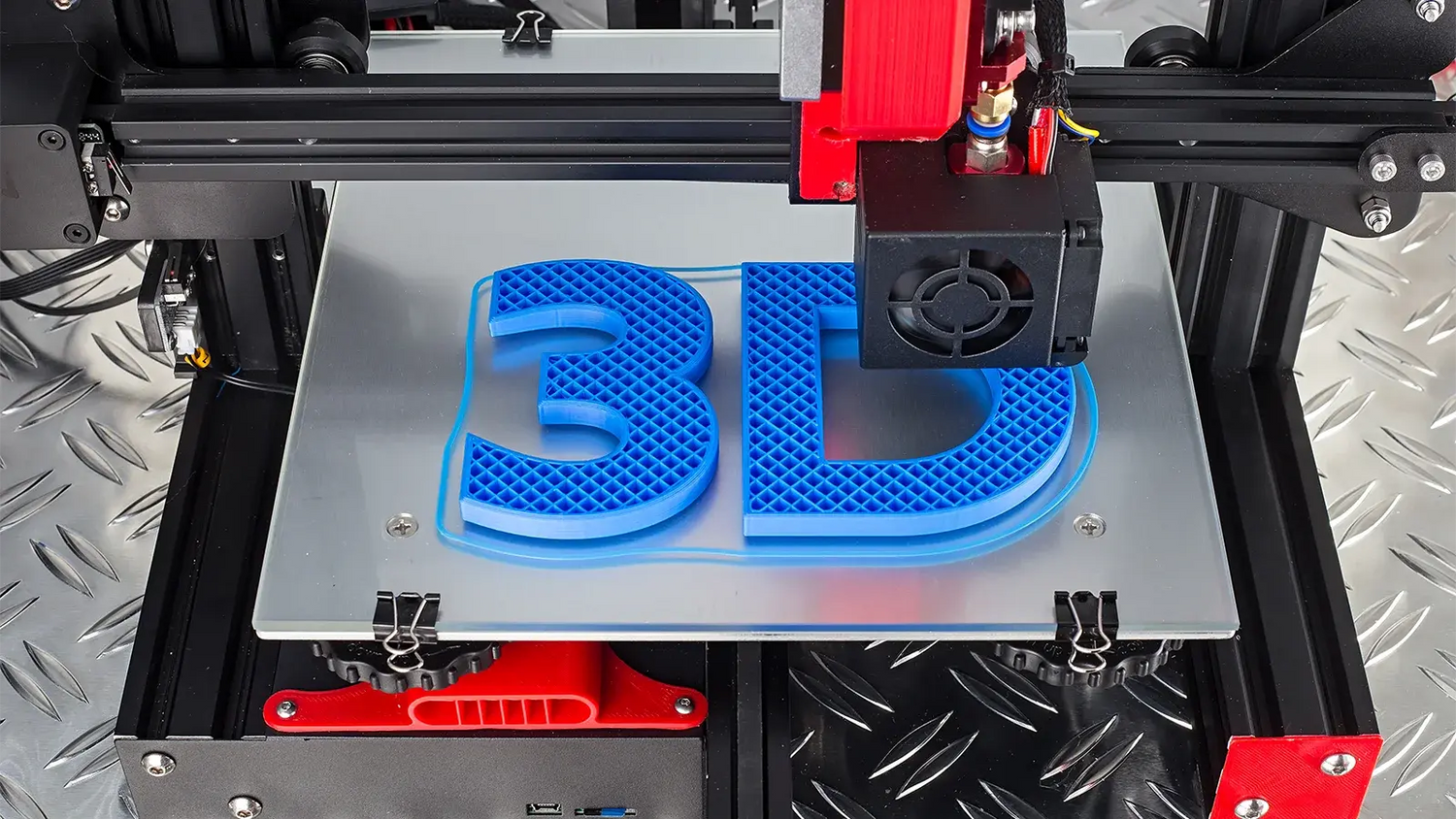 A 3D printer printing the number 3 and the letter D