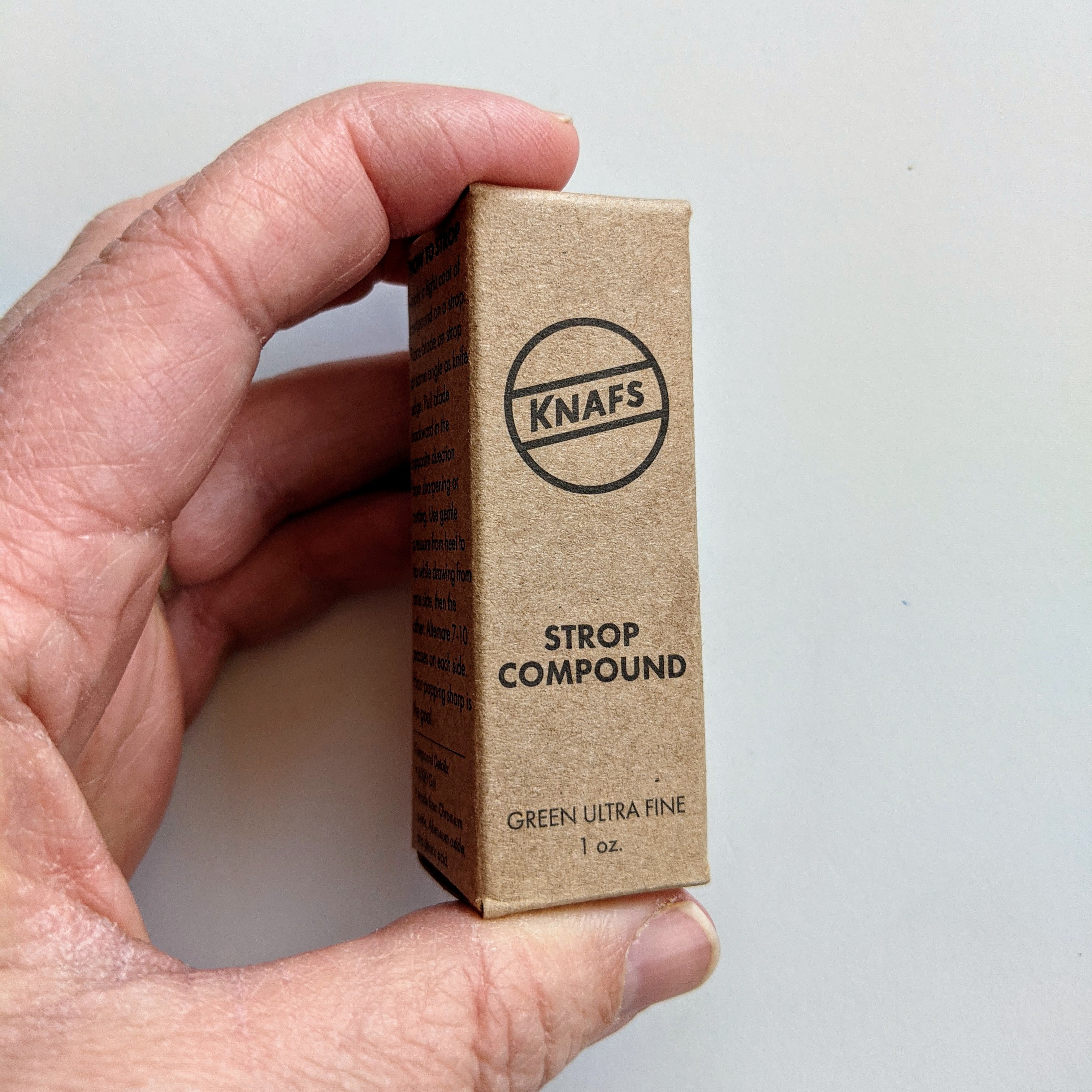 Strop Compound - Green Ultra Fine box in hand